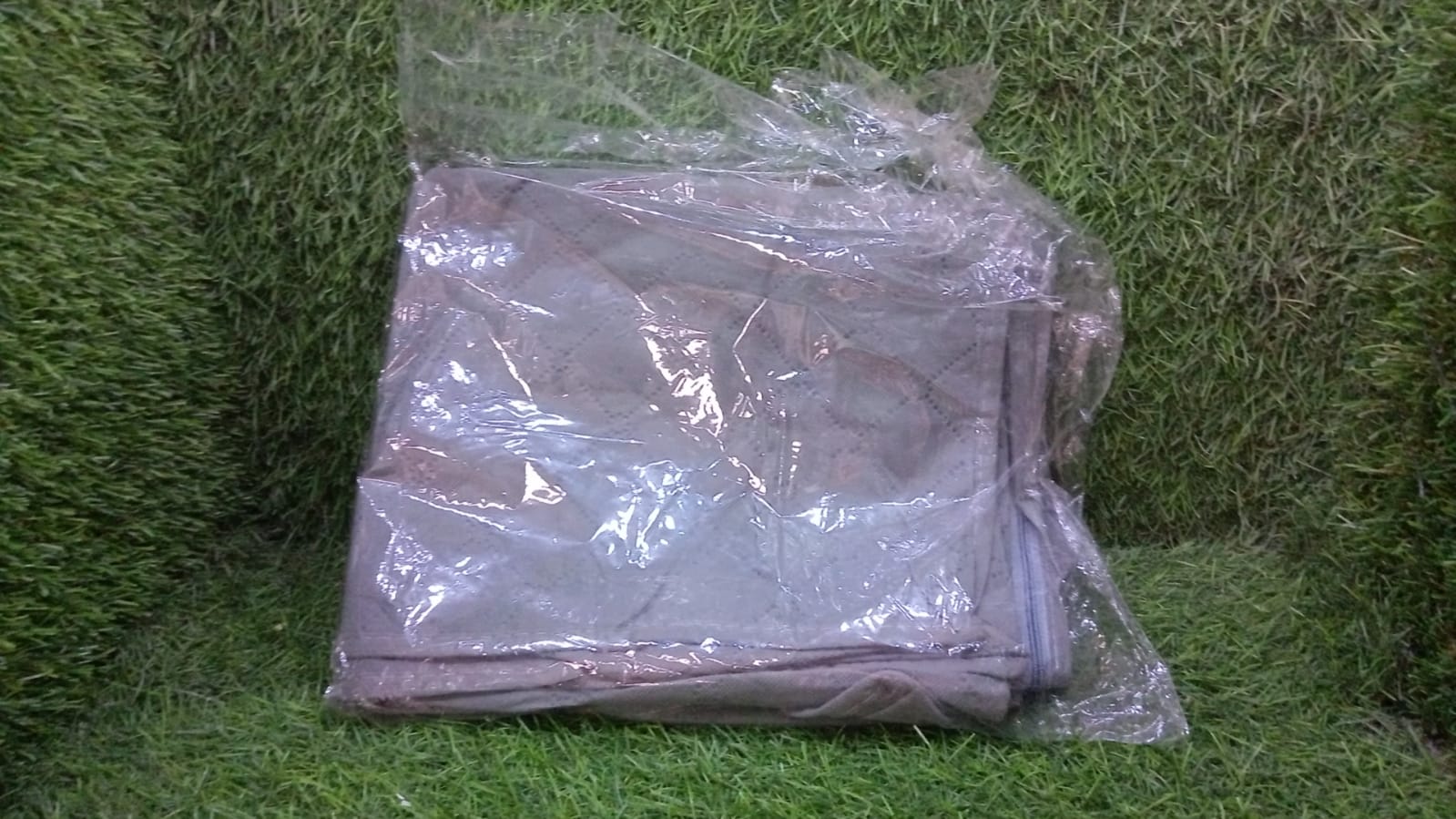 Suit cover with fold-over design Suit cover with fold-over design